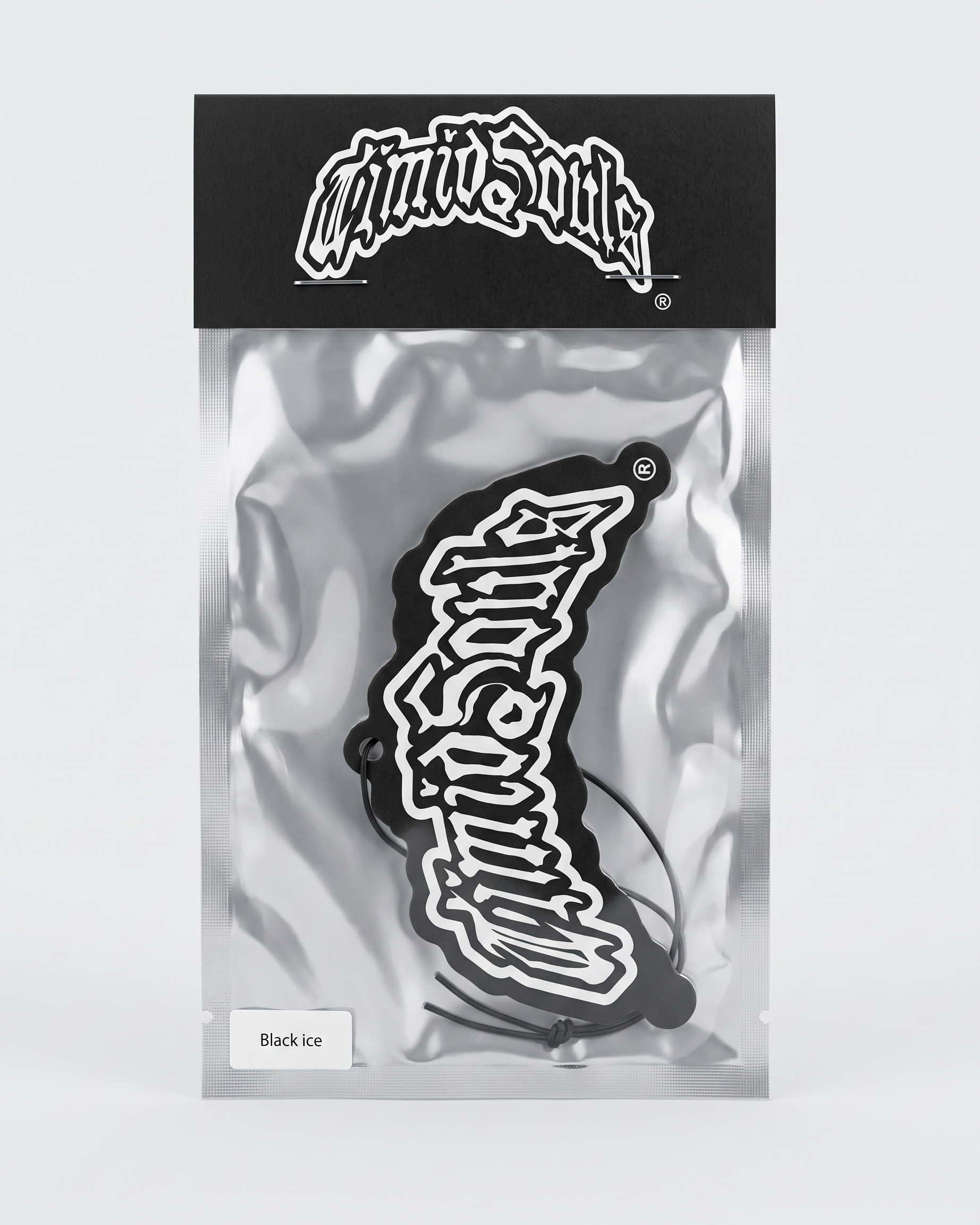 A black and white 'Mini Suite' sticker in its original packaging, featuring a black header card with the white logo and a silver foil bag containing the sticker.