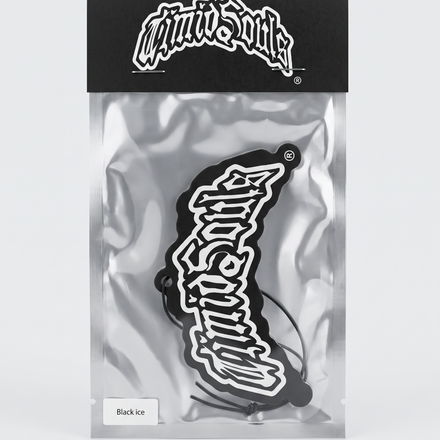 A black and white 'Mini Suite' sticker in its original packaging, featuring a black header card with the white logo and a silver foil bag containing the sticker.